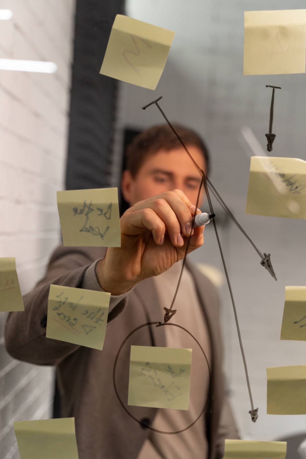 Engineer at glass whiteboard